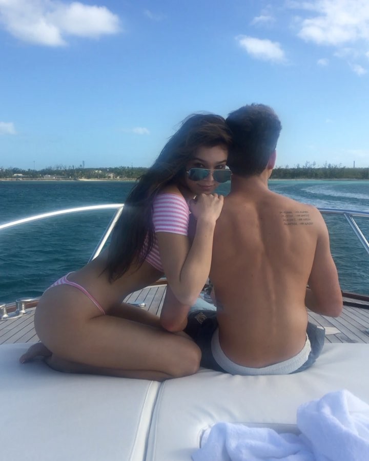 Hailee Steinfeld on a Boat in a Bikini with a guy