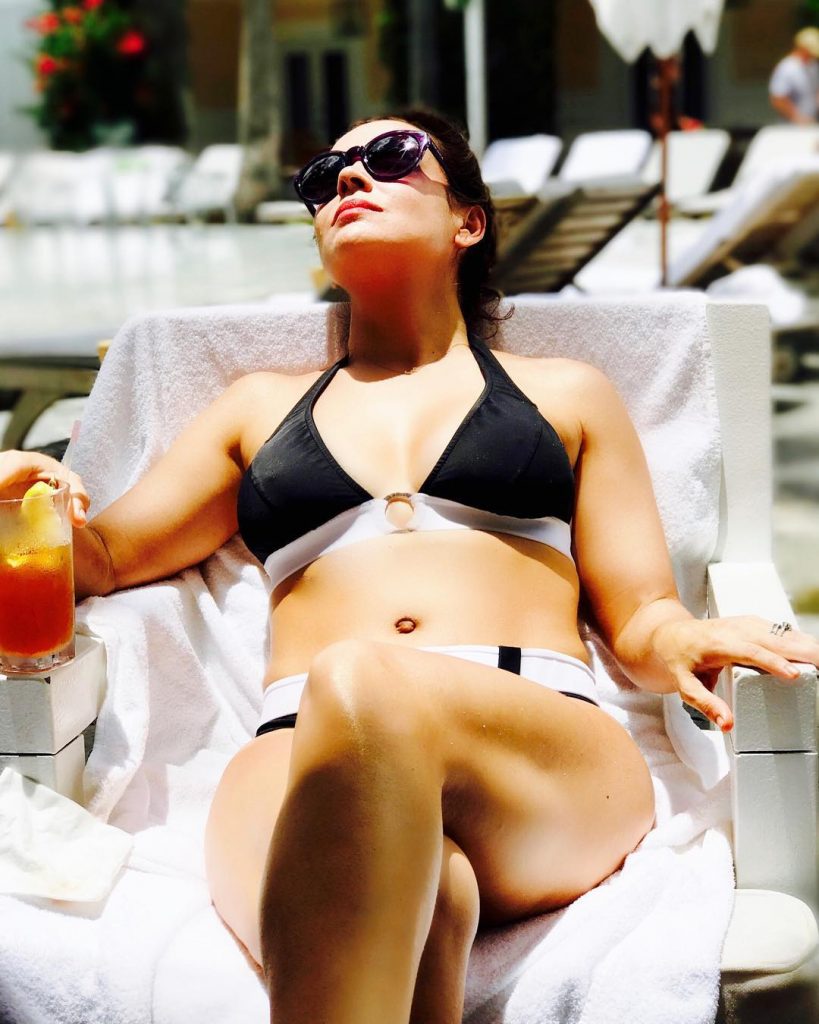 Alyssa Milano sunbathing in a bikini