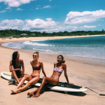 Lais Ribeiro, Romee Strijd & Jasmine Tooke in bikinis on a surf board