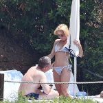 Gillian Anderson in a bikini while her husband looks to see if her vagina is still there