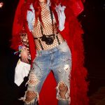 Bella Thorne denim over a fishnet body suit
