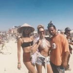 Candice Swanepoel with her tits out at burning man