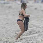 Sexy Hillary Duff in a wet black bikini on the beach