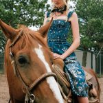 Lara Stone on a horse