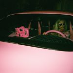 Paris Hilton in her pink bently