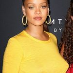 Rihanna in a canary yellow see through top