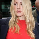 Ellie Goulding in a tight sheer red shirt