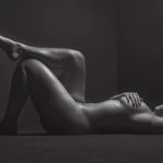 Ashley Graham on her back naked