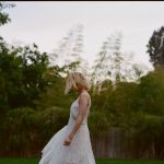 Emma Roberts in a white dress