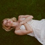 Emma Roberts in the grass