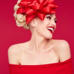 Gwen Stefani with a red bow on her head