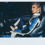 Hailey Baldwin in a leather outfit in a car