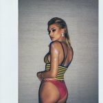 Hailey Baldwin oiled up in a pair of red underwear