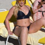iskra lawrence spreading her legs on the beach in a bikini