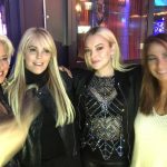 Lindsay Lohan and her mom Dina posing with fans