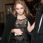 Lily-Rose Depp in a black lace dress leaving an event