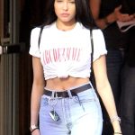 Madison Beer in a crop top and jeans