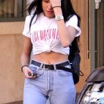 Madison Beer in a white shirt and mom jeans