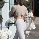 Olivia Culpo ass in white leggings and a beige sweater