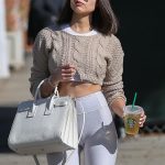 Olivia Culpo hiding her camel toe in white leggings and a crop top