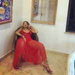 Rihanna spread out in her red dress