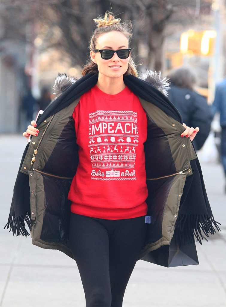 Olivia Wilde Wears a red impeach sweater
