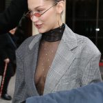 Bella Hadid Cleavage in a sheer shirt and blazer