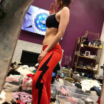 Bella Thorne stands in her own filth wearing a bra and smoking a blunt