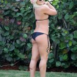 Brooke Hogan poses for the camera in her black bikini