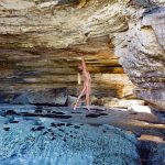 Candice Swanepoel in a cave