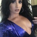 Demi Lovato in purple sequin shirt