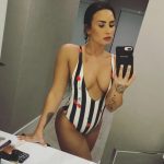 Demi Lovato in a stripped one piece