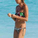 Elle Macpherson is old as hell but is stilll rocking a bikini with her saggy skin
