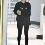 Emma Roberts in A black Hoodie and Black Leggings