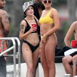 Halsey in a black bikini with a girlfriend in yellow bikini