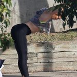 J.Lo in leggings and a crop top bending over