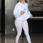 Jennifer Lopez in a white hoodie and white leggings