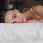 Lily Rose Depp Laying in a bed