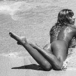 Madeline Relph naked laying in the sand