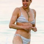 Michelle Rodriguez wears a swimming cap and a bikini at the beach
