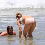 Miley Cyrus Bends over in a Bikini