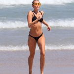 Miley Cyrus on the beach in a black bikini