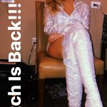 Miley Cyrus sits back in thigh high silver boots