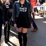 Olivia Munn in a T Shirt and Black Boots