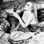 Pamela Anderson Throwback Naked in the Pool with A Glass