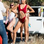 Rachel McCord posing in a red bathing suit