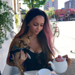 Vanessa Morgan Tits out with her Dog