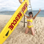 Charli XCX in a yellow bikini on the beach