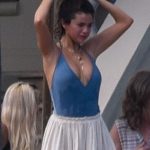 Selena Gomez cleavage in a deep cut swimsuit at Justin Biebers Dads Wedding