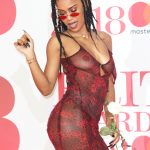 IAMDDB showing big tits and little nips in a see through red dress at the BRIT awards